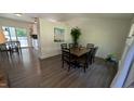 Bright dining room with modern flooring, a large picture window and contemporary decor at 6125 Bellow St, Raleigh, NC 27609