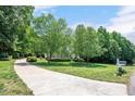 Inviting home with mature trees, lush lawn and long driveway at 7716 Micklewaithe Ct, Wake Forest, NC 27587