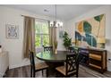 Dining room features a round table with seating and natural light from a window at 820 Laurel Gate Dr, Wake Forest, NC 27587