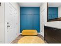Stylish entryway featuring a yellow accent bench, modern decor, and a minimalist design at 820 Laurel Gate Dr, Wake Forest, NC 27587