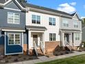 Beautiful townhome featuring multiple stories, charming entrance and neutral-colored facade at 820 Laurel Gate Dr, Wake Forest, NC 27587