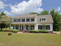 Beautiful two-story home featuring a large front yard, covered porch, and classic curb appeal at 101 Cardinal Dr, Youngsville, NC 27596