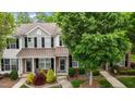 Charming townhome featuring a well-manicured front yard and a welcoming entrance at 1096 Kelso Ln # 18, Burlington, NC 27215