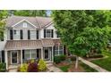 Charming townhome featuring a well-manicured front yard and a welcoming entrance at 1096 Kelso Ln # 18, Burlington, NC 27215