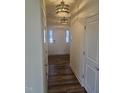 Inviting foyer with hardwood floors, neutral paint, and modern lighting at 12 Lavender Ln, Clayton, NC 27520