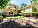 Charming two-story home featuring a covered front porch and well-maintained landscaping at 1605 Park Dr, Raleigh, NC 27605