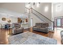 Spacious living room with soaring ceilings, staircase and hardwood floors, creating a welcoming and grand entrance at 200 Heather Brook Cir, Spring Lake, NC 28390
