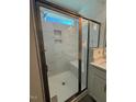 Bathroom featuring a glass enclosed shower with white marble tile and bench seat at 214 Alden Way, Angier, NC 27501