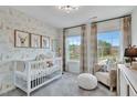 Cozy Bedroom with adorable animal-themed wallpaper and plenty of natural light at 2207 Lambert Rd # 69, Cary, NC 27519