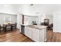 Open-concept kitchen with island and stainless steel appliances overlooking the dining and living areas at 224 Brisk Dr, Zebulon, NC 27597