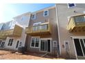 Townhome backyard view with a small deck or balcony overlooking the lawn and wooded area at 2297 Bay Minette Sta # 536, Apex, NC 27502