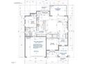 Detailed first-floor layout featuring a kitchen, breakfast nook, living room, dining area, guest suite, and two-car garage at 2408 Eagle Shot Ct # 4, Fuquay Varina, NC 27526
