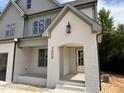 Charming front entrance features painted brick detail, address numbers, and overhead outdoor lighting at 2408 Eagle Shot Ct # 4, Fuquay Varina, NC 27526