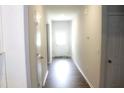 Bright hallway leading to front door, featuring neutral walls and hardwood floors at 255 Rosemount, Rocky Mount, NC 27804