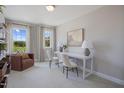 Well-lit office with white desk and two chairs, perfect for a productive work environment at 27 Hyacinth Ln # 164, Angier, NC 27501