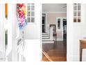 Open foyer with hardwood floors and a view into a light-filled home at 302 Villa St, Rocky Mount, NC 27804
