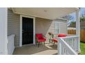 Inviting front porch with comfortable seating, perfect for relaxing and enjoying the outdoors at 311 Oakley St, Graham, NC 27253
