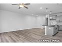 Spacious living room view showcasing open layout and seamless flow into the adjacent kitchen at 3918 Well Fleet Dr, Fuquay Varina, NC 27526