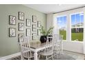 Bright dining room features stylish decor and a large window for natural light at 40 Honeydew Way, Clayton, NC 27520