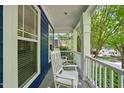 Relaxing porch with white rocking chairs, offering a serene outdoor space to unwind at 420 Marsh Landing Dr, Holly Springs, NC 27540