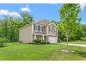 Beautiful home with a well-manicured lawn, lovely landscaping and a two car garage at 4221 Northrop Dr, Haw River, NC 27258