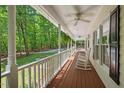 Inviting porch with rocking chairs and ceiling fans, perfect for relaxing outdoors at 524 Preston Andrews Rd, Bahama, NC 27503