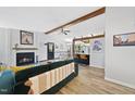 Spacious living area with vaulted ceilings, a fireplace, and an open floor plan perfect for entertaining guests at 5300 Whippoorwill St, Durham, NC 27704