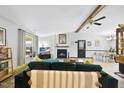 Inviting living room featuring a fireplace, vaulted ceiling, and modern furnishings for relaxation and entertainment at 5300 Whippoorwill St, Durham, NC 27704