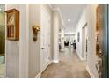 Hallway featuring neutral tones, tiled floor, detailed trim work and an open concept design at 108 Boone St, Chapel Hill, NC 27516