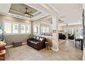 Cozy living room showcasing an open-concept floor plan with a tray ceiling and many windows at 108 Boone St, Chapel Hill, NC 27516