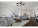 Bright living room showcasing modern decor, hardwood floors, and a stylish area rug at 1211 Brown Velvet Ln, Apex, NC 27523