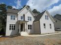 Charming two-story home with white brick and gabled roof at 1444 Old Apex Rd, Cary, NC 27513