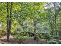 Inviting two-story home nestled among towering trees, creating a private and peaceful atmosphere at 1767 Quince Loop, Sanford, NC 27332