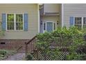 Welcoming front entrance featuring a classic door, side window and brick accents, exuding timeless charm at 1767 Quince Loop, Sanford, NC 27332