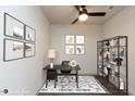 Home office featuring modern furnishings, contemporary artwork, and a stylish bookshelf at 2205 Gathering Square Ct, Fuquay Varina, NC 27526