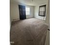 Comfortable bedroom with plush carpeting and natural light from the window at 304 Culvert St, Apex, NC 27502