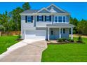 Charming two-story home with a well-manicured lawn and a classic architectural style at 355 Beacon Hill Rd # 23, Lillington, NC 27546