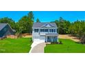 Charming two-story home with a well-manicured lawn and a classic architectural style at 355 Beacon Hill Rd # 23, Lillington, NC 27546