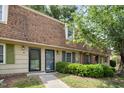 Townhouse complex with sidewalks and shrubbery at 4822 Blue Bird Ct # B, Raleigh, NC 27606
