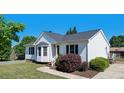Charming home with a tidy front lawn and a welcoming walkway at 500 Lemontree Ct, Graham, NC 27253