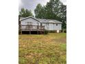A spacious backyard features a large deck, providing ample outdoor living and entertaining space at 6216 Krandon, Raleigh, NC 27603