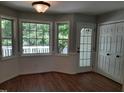 Bright breakfast nook with multiple windows and a door leading to the outdoors at 640 Sagamore Dr, Louisburg, NC 27549