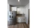 Modern kitchen boasts stainless steel appliances and shaker cabinets with matte black hardware at 1010 Westerland Way # 200, Durham, NC 27703