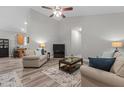 Neutral living room with plenty of natural light, hardwood floors, ceiling fan, and open floor plan at 105 Oak Ridge Rd, Franklinton, NC 27525