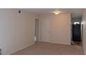 An inviting living room featuring neutral carpet and paint, with views into the kitchen area at 108 Ephesus Church Rd # Apt 416, Chapel Hill, NC 27517