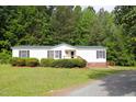 Welcoming single-story home with well-maintained lawn and a convenient access ramp at 1201 Red Sunset Pl, Siler City, NC 27344