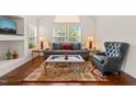 Bright living room with lots of natural light, a comfortable sofa and elegant decor throughout at 1408 Fairmont St, Durham, NC 27713