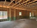 Living room framing showing wiring, and several window locations at 214 Green Pines Estates Dr, Kenly, NC 27542