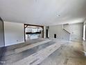Bright open living space flows into the unfinished kitchen, offering a great layout for future updates and customization at 2802 Packing Plant Rd, Smithfield, NC 27577