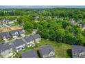 A serene neighborhood nestled among lush greenery provides a sense of tranquility and community at 4024 Dunkirk Dr, Burlington, NC 27215